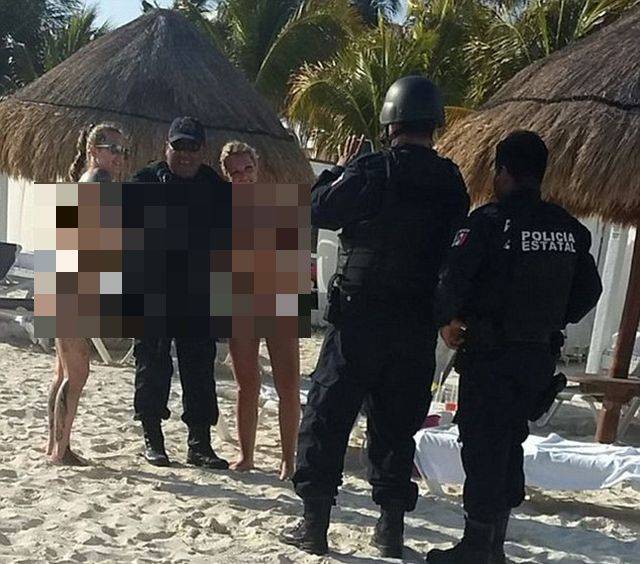 Cancun Cops Got Punished For… Posing With Topless Girls