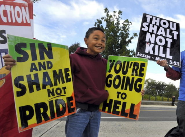 Hateful Signs from the Kids of Westboro Baptist Church